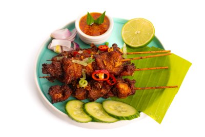 Chicken Satay - Freshly grilled marinated chicken skewers with authentic Malaysian spices, served with peanut sauce and cucumber